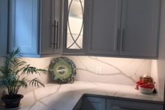 Quartz with bold veining and full height splash.