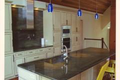 Full height splash with pot filler faucet.