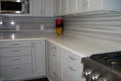 Striated marble kitchen countertops with full height splash in Waldorf.