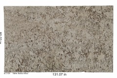 Bianco Antico granite. Cream colored bedrock with huge pieces of mica and bits of beige, tan and white consistently spread across entire stone.  Mid-range price.