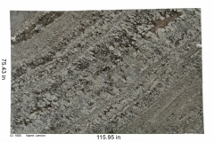 Lennon granite.  Overall is a gray stone that is broken up by a white bedrock with blue hues and covered in mineral deposits consisting of quartz, feldspar and mica. A unique stone that looks great with most color schemes.  Mid price range.