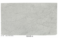 White Carrara marble. Carrara white marble is one of the iconic luxury Italian marbles featuring shades of whites and gray with a honed finish.  Check our bathroom gallery to see some vanities we've done in this material.  Mid range price.