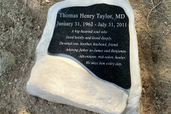 Organic shaped plaque on boulder headstone.